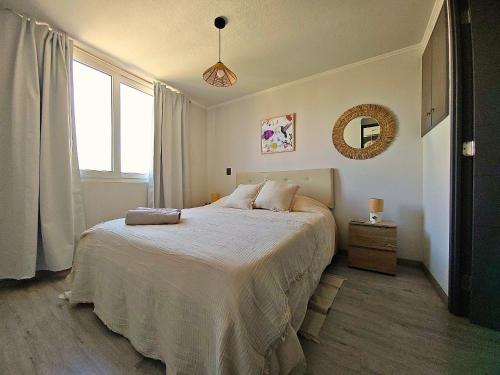 Postel nebo postele na pokoji v ubytování Sierra Ñuñoa Suite