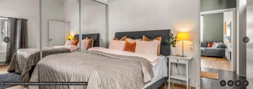 Ένα ή περισσότερα κρεβάτια σε δωμάτιο στο Midtbyen Apartment