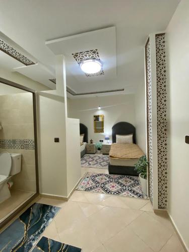 a living room with a bed and a room with a bed sqor at Dar El Yacout in Rabat