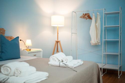 a bedroom with a bed with towels on it at Sottani di Puglia in Castellana Grotte