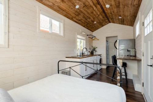 a room with a bed in a tiny house at Stay Portland - The Tiny Farmhouse on Alberta in Portland