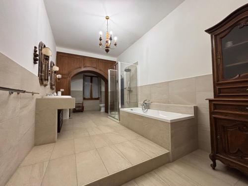 a large bathroom with a tub and a sink at Castello Vinci - Dimora di Charme in Vetralla