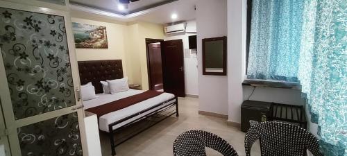 Postel nebo postele na pokoji v ubytování JS Holidayss Inn