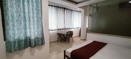 Postel nebo postele na pokoji v ubytování JS Holidayss Inn