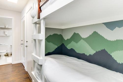 a bedroom with a bunk bed with a green wall at 1 Mi to Keystone Resort Mtn-View Family Escape! in Keystone