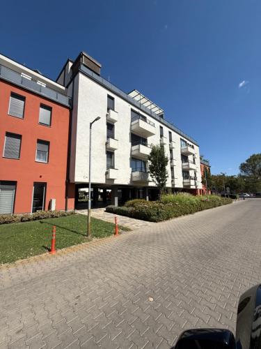 an empty street in front of a building at Rita Apartment G3- Free Parking for 1 Car & Balcony in Kecskemét