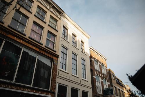 a row of buildings on a city street at Boutique hotel the Grand in Nijmegen