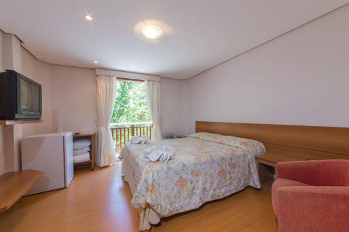 Postel nebo postele na pokoji v ubytování Pousada Joia da Serra by Hotel Platanus