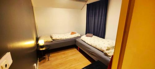 Ένα ή περισσότερα κρεβάτια σε δωμάτιο στο Odin Rooms