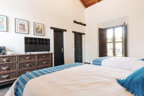 Ένα ή περισσότερα κρεβάτια σε δωμάτιο στο Casa Natania