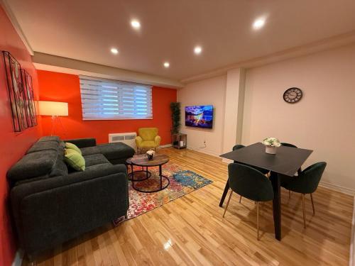 a living room with a couch and a table at Cute & Cozy Hub for Montreal Travelers in Montréal