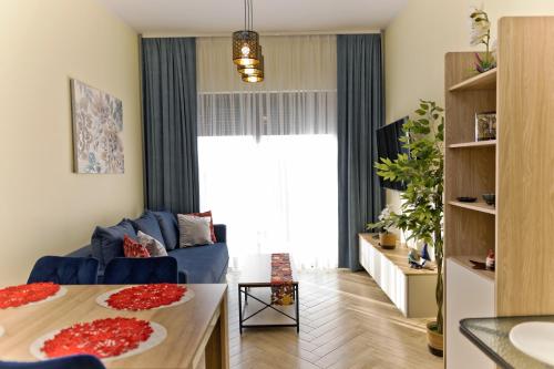 Postel nebo postele na pokoji v ubytování Hevenia Mrzeżyno 8