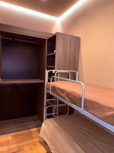 En eller flere senge i et værelse på Domus Carignano Luxury Apartment