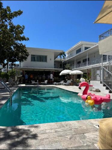 a swimming pool with a inflatable pool noodle in a hotel at Royal Palms Resort & Spa in Fort Lauderdale