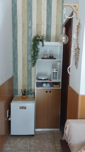 Kuchyň nebo kuchyňský kout v ubytování Suíte Nosso Mar Doce Lar em Conceição de Jacareí