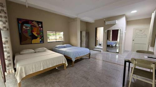 Ένα ή περισσότερα κρεβάτια σε δωμάτιο στο Casa de Perú Iquitos- Hotel & Restaurant