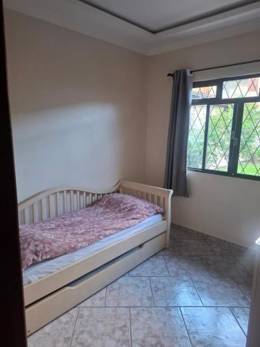 Giường trong phòng chung tại Casa Feliz