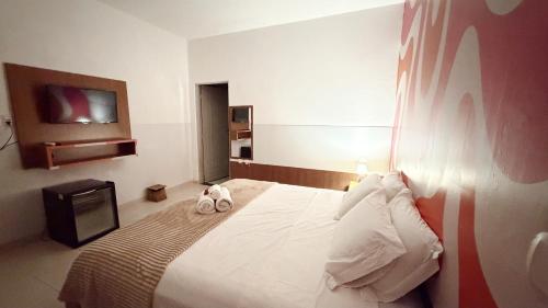 Uma cama ou camas num quarto em Casa da Keka em Noronha