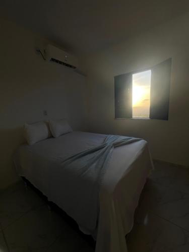 Ένα ή περισσότερα κρεβάτια σε δωμάτιο στο Apartamento da Kenia