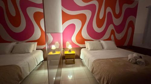 Uma cama ou camas num quarto em Casa da Keka em Noronha