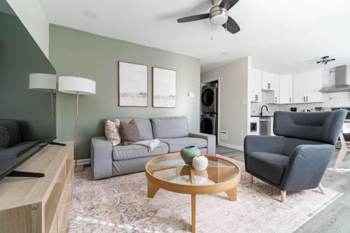 a living room with a couch and a table at The Vibe on Durham VI 8783 in Durham