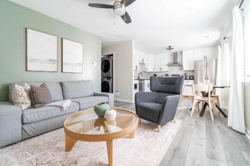a living room with a couch and a table at The Vibe on Durham VI 8783 in Durham