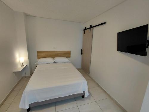 Voodi või voodid majutusasutuse Hotel Stadio Cali toas