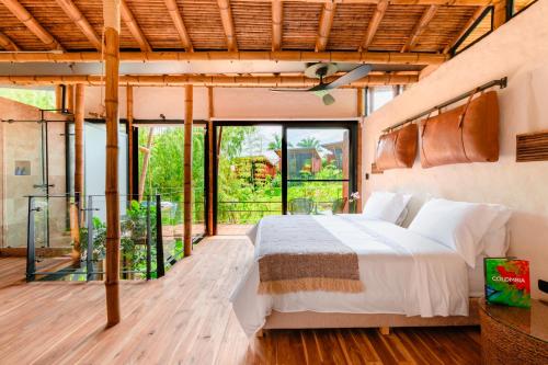 Ένα ή περισσότερα κρεβάτια σε δωμάτιο στο Kawa Bamboo Retreat