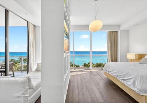 a bedroom with a view of the ocean at High-end Coastal Escape in Sunny Isles Beach
