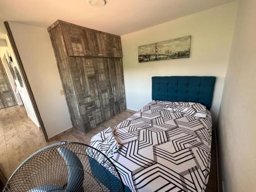 Ένα ή περισσότερα κρεβάτια σε δωμάτιο στο Apartamento en hacienda peñalisa mango, Ricaurte