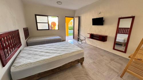 Ένα ή περισσότερα κρεβάτια σε δωμάτιο στο hotel villa chucum