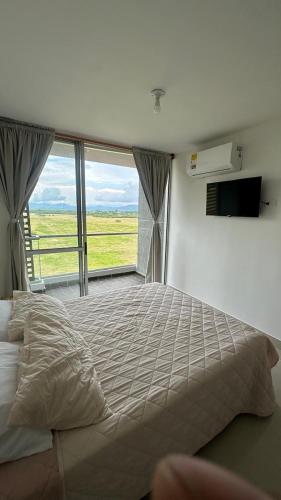 Una cama o camas en una habitación de Peñazul la aldea 957
