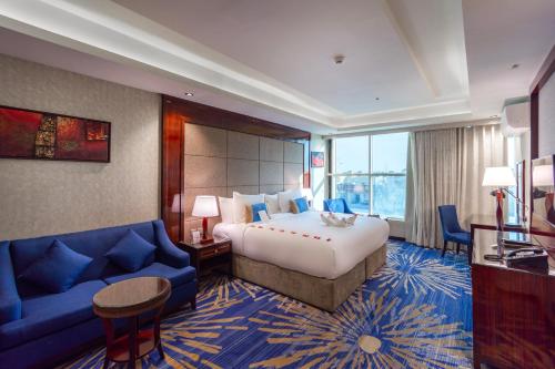 Voodi või voodid majutusasutuse Seven Gardens Hotel Al Wadi toas