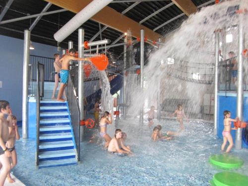 a group of children playing in a water park at Villapark de Paardekreek in Kortgene