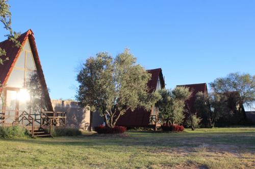 an image of a church with the sun shining on it at Cabañas Hacienda de Letras in Pabellón de Arteaga