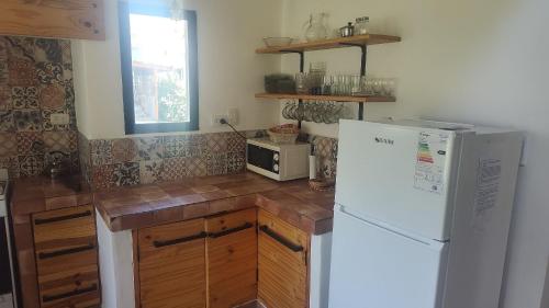 Køkken eller tekøkken på El descanso tiene nombre: Sonko