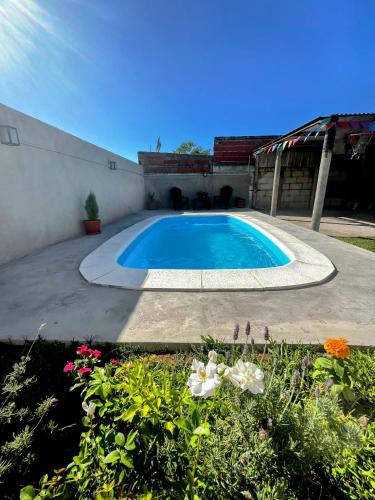 a swimming pool in the middle of a yard at Casa Guemes in Victoria