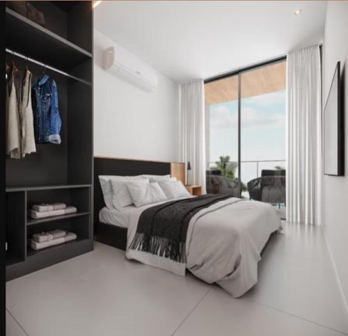 En eller flere senge i et værelse på Resort Praia Muro Alto