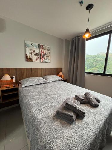 Ένα ή περισσότερα κρεβάτια σε δωμάτιο στο Studio 2 min do Hospital Unimed e Shopping Park Sul