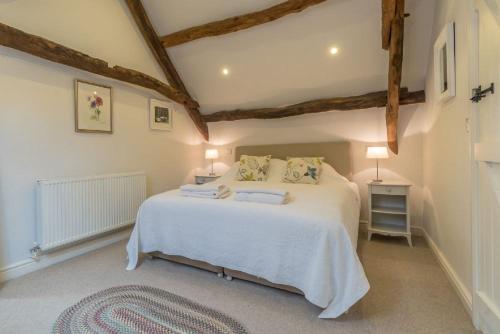 Ένα ή περισσότερα κρεβάτια σε δωμάτιο στο Coed-Stable