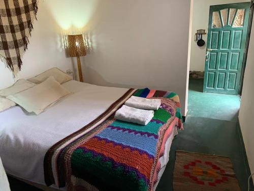 Ένα ή περισσότερα κρεβάτια σε δωμάτιο στο Cabaña El Secadero Mi Campito Cachi Salta