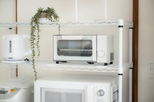 Η κουζίνα ή μικρή κουζίνα στο 家族旅館四国周遊元山