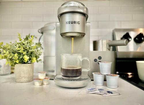 a mixer sitting on top of a kitchen counter at WorkerFriendly KINGbed A plus Location Washer Wifi Pool in Sherman