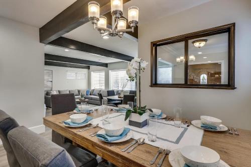 a dining room with a table and a mirror at Destination #41 in Fullerton