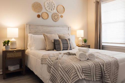 a bedroom with a bed with two towels on it at Spacious 3 Bed Condo Near ETSU in Johnson City