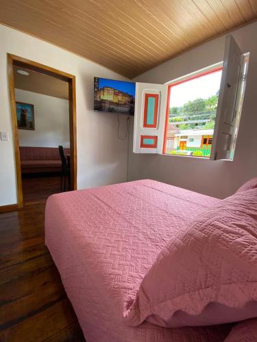 Ένα ή περισσότερα κρεβάτια σε δωμάτιο στο Posada Casa Linda