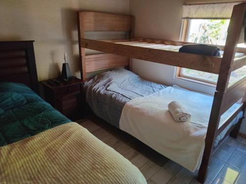 Postel nebo postele na pokoji v ubytování Cabaña los sauces