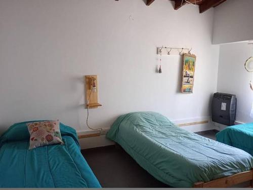 Postel nebo postele na pokoji v ubytování Los Gurises