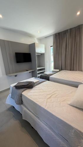 Postel nebo postele na pokoji v ubytování Villa Eco Barra- Apartamento 106