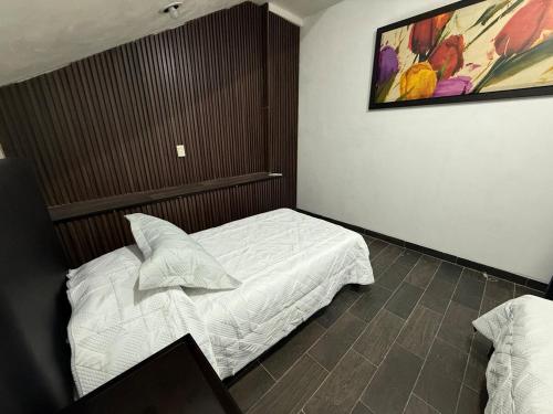 Ένα ή περισσότερα κρεβάτια σε δωμάτιο στο La Lomita Suite #2 climatizada